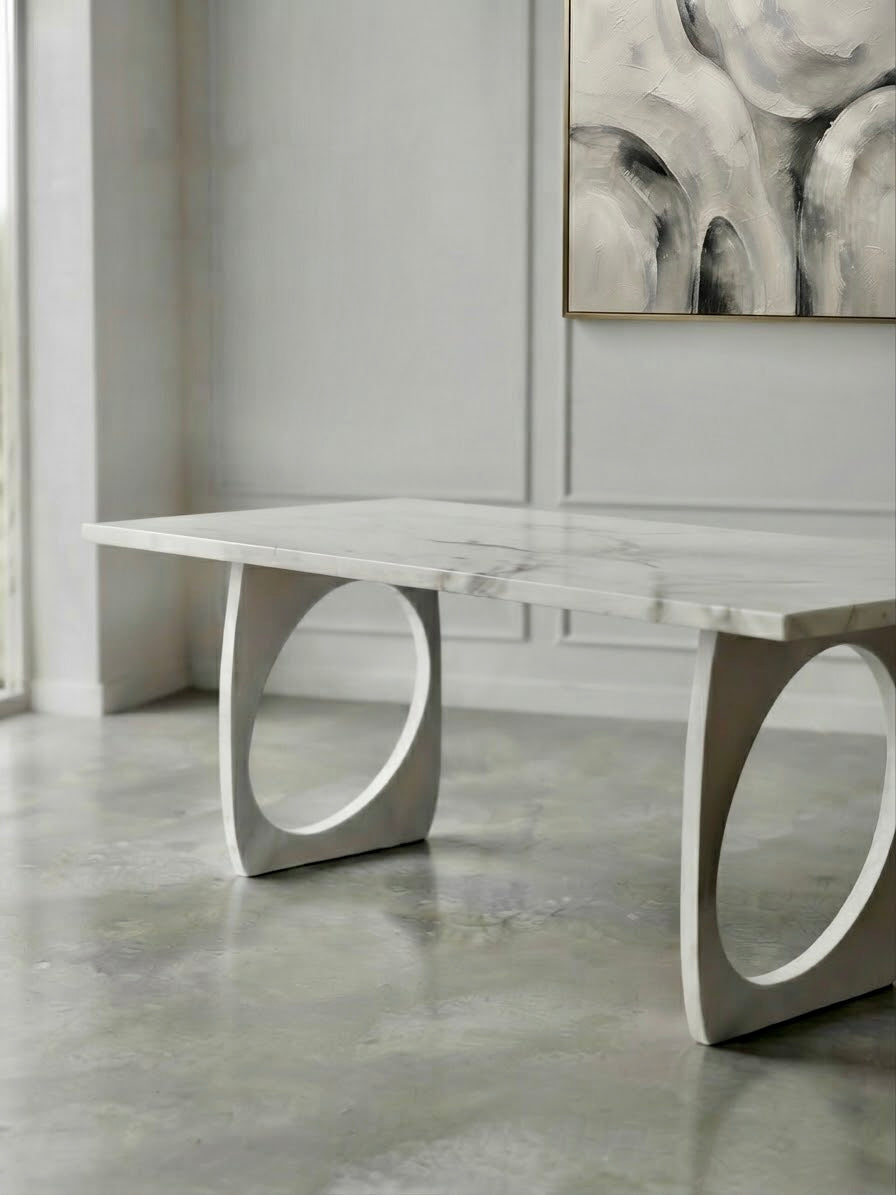 A bespoke marble design dining table. With sculptural legs. Following trend of 2027